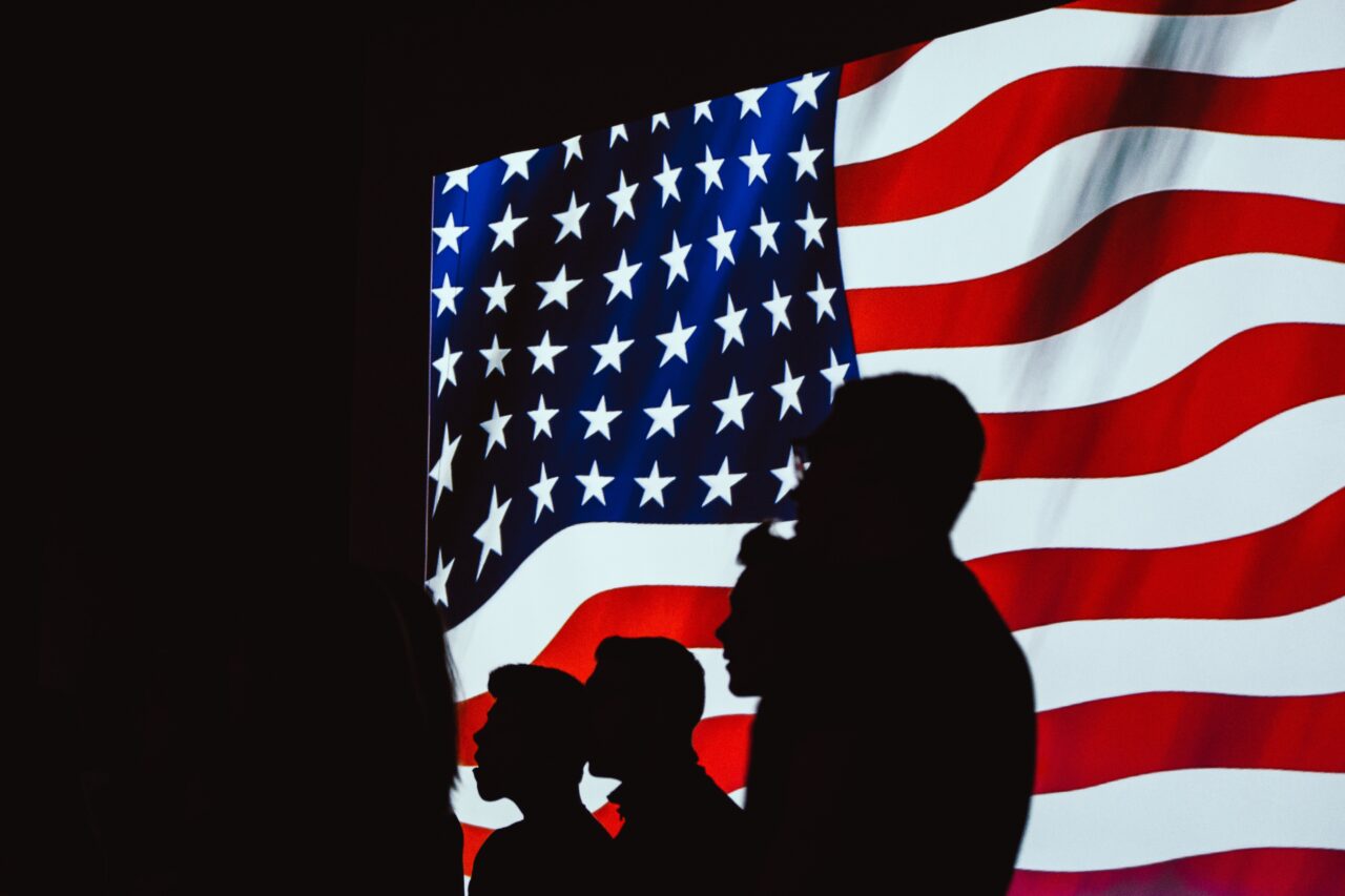 Silhouette-of-people-beside-usa-flag-1046399